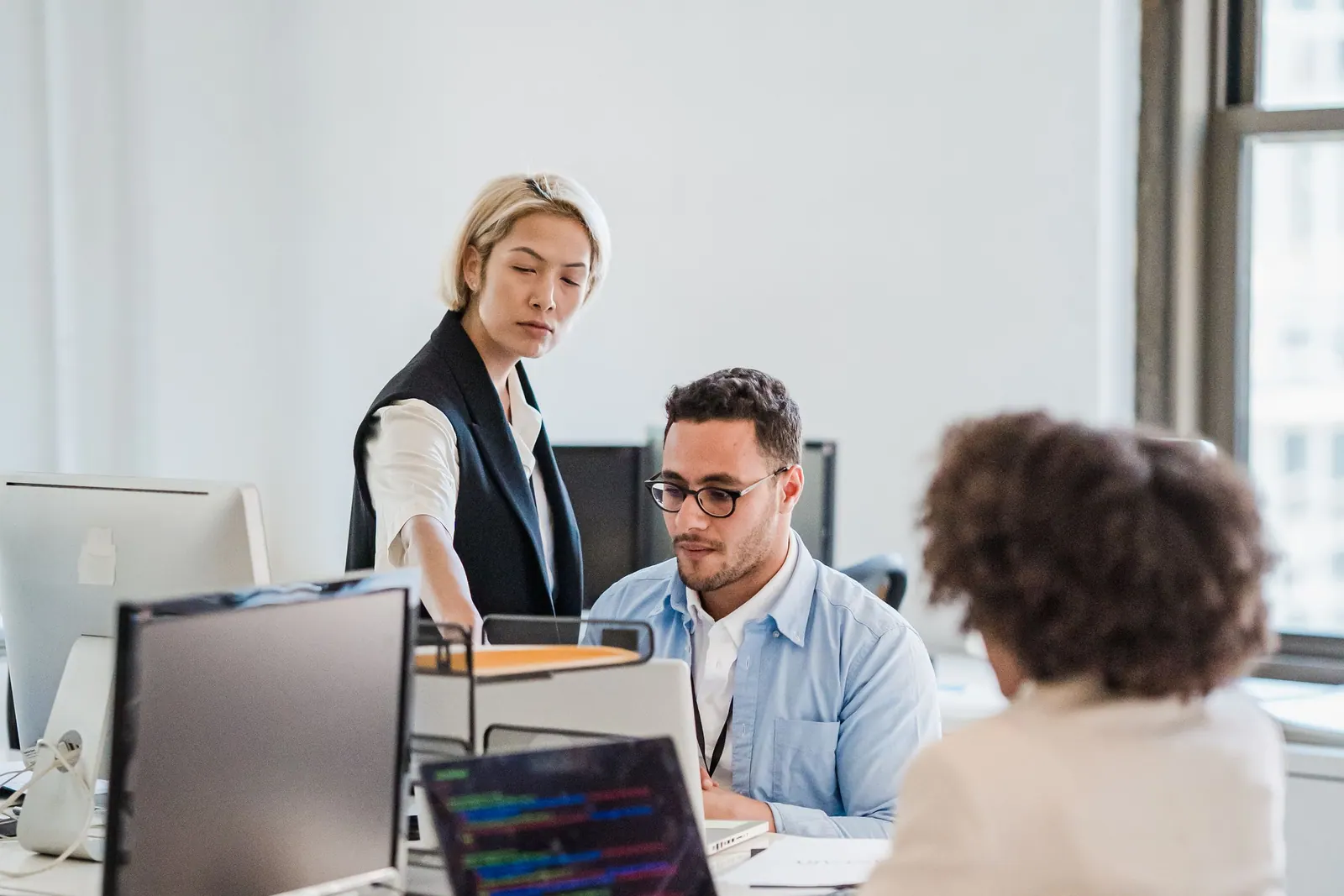 A company director working with her team