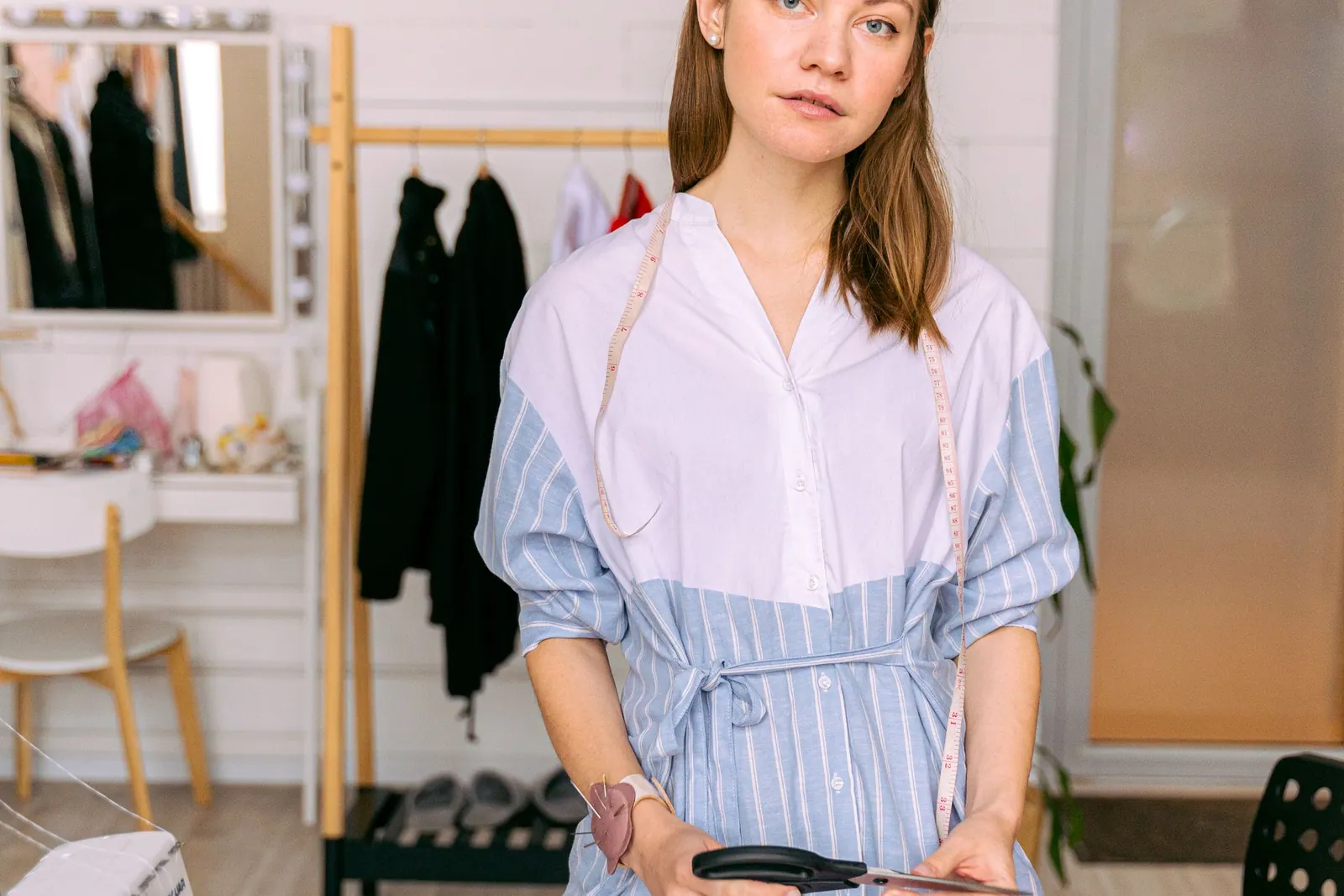 A sole proprietor in her clothing studio