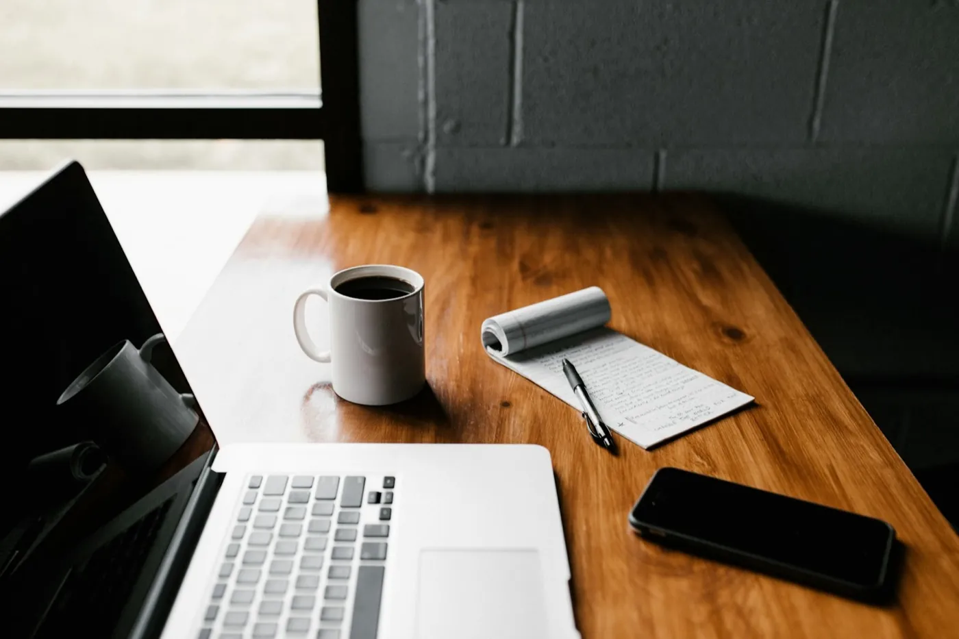 Bookkeeping on a laptop with coffee