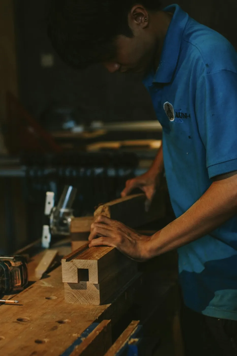 Carpenter working with tools in a workshop